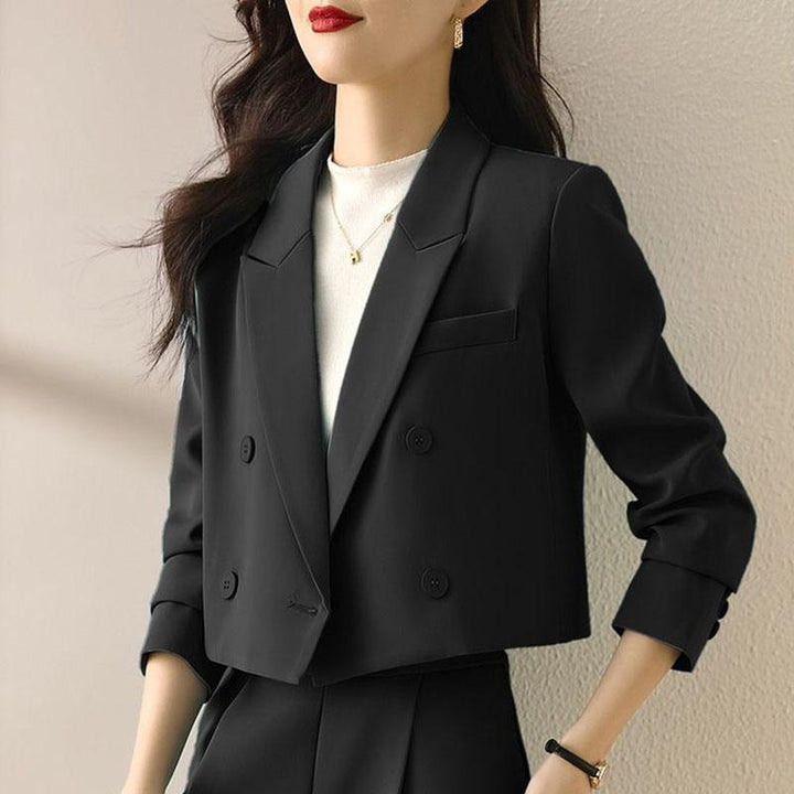 Chic double-breasted cropped blazer for women. Elevates any office outfit with modern workwear style.