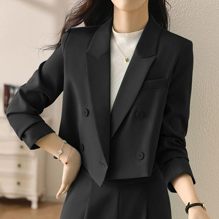 Professional women's cropped double-breasted blazer. Ideal for stylish workwear, office or business settings.