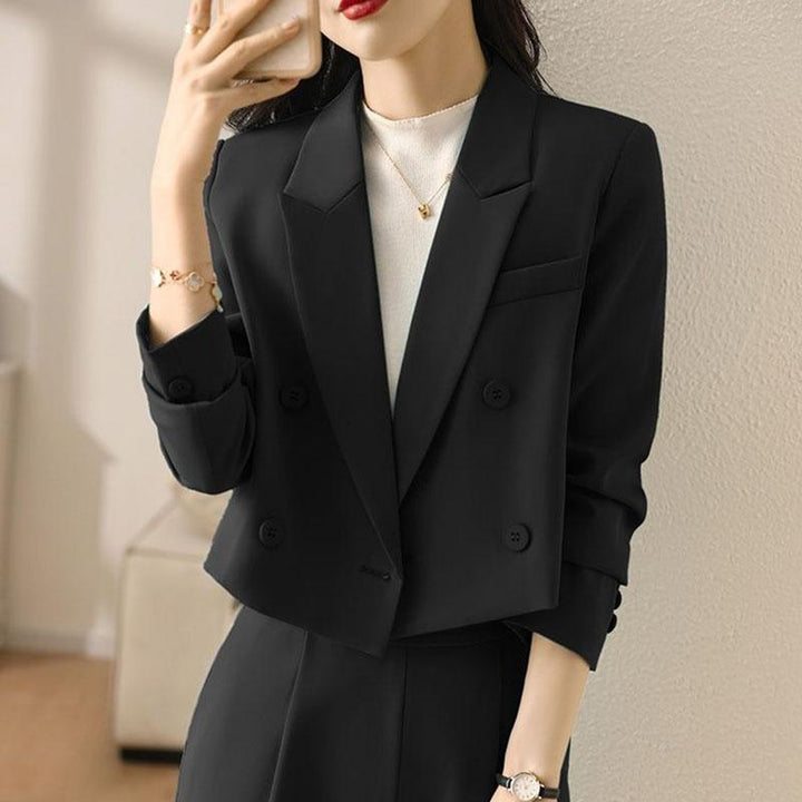 Elegant women's cropped blazer with double-breasted front. A sophisticated choice for professional attire.