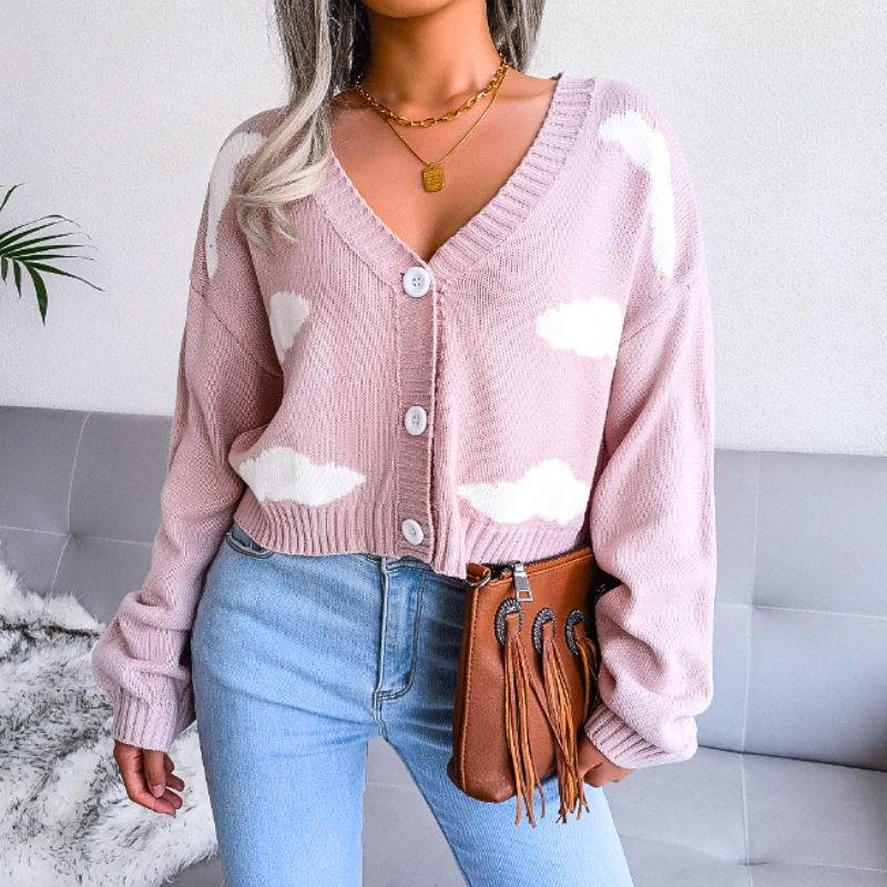 Layer this women's cropped cardigan with cloud print. Features V-neck, button-up closure; perfect for spring outfits.