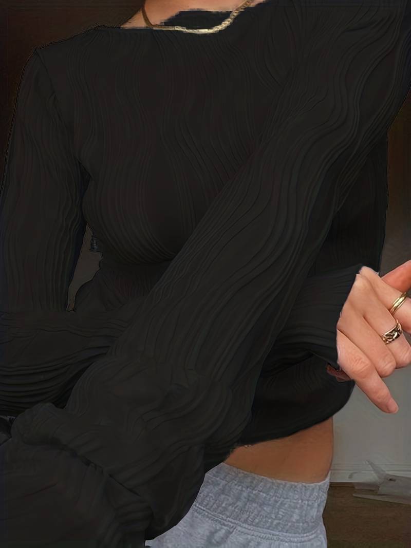 Cropped long sleeve women's top with distinctive wave texture and elegant puff cuffs. A stylish, versatile fashion piece.