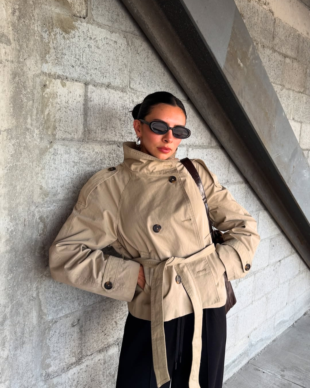 Elegant women's belted cropped trench coat, perfect chic outerwear for fall fashion.