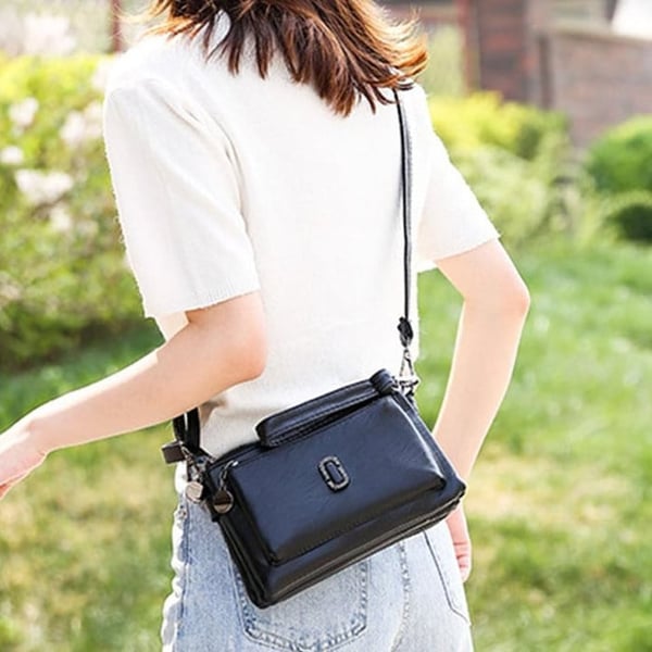 Stylish women's versatile sling bag, a small crossbody purse ideal for daily essentials and travel.