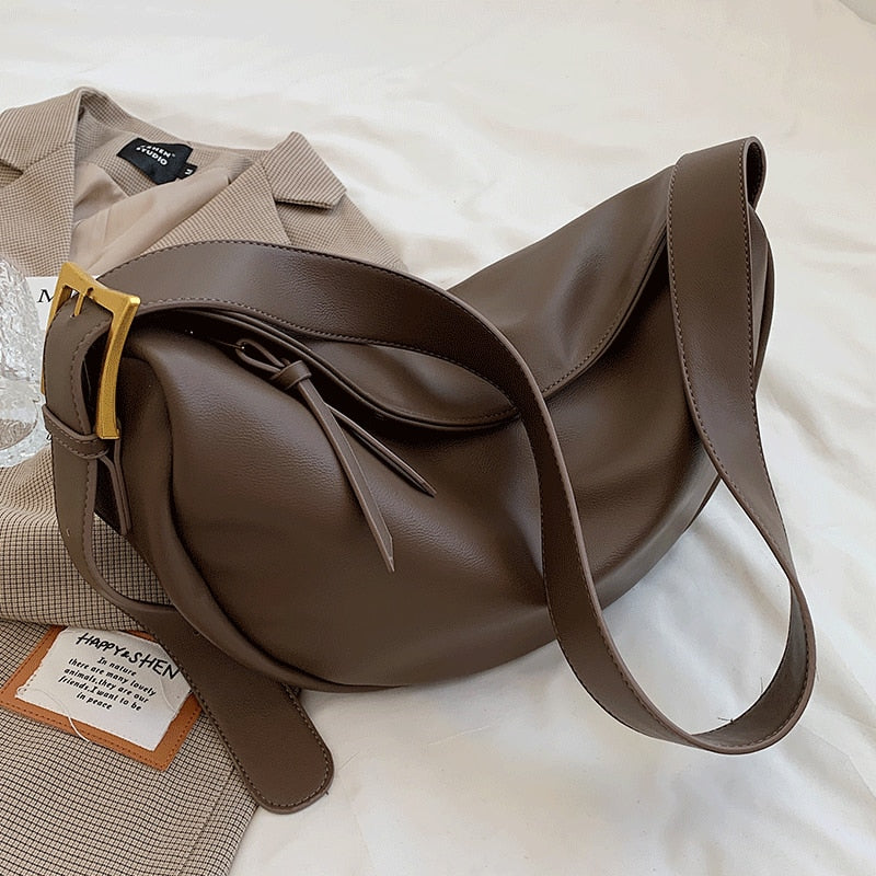 Coffee brown adjustable strap women's crossbody bag, minimalist design for versatile everyday wear.