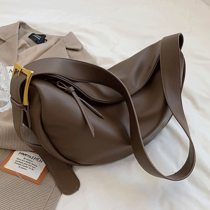 Coffee brown adjustable strap women's crossbody bag, minimalist design for versatile everyday wear.