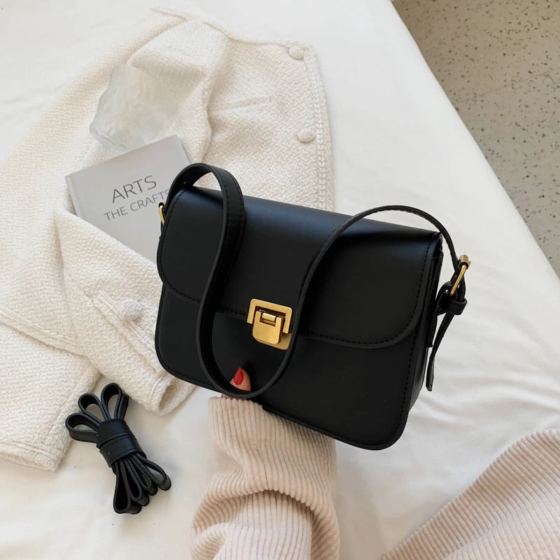 Versatile women's small crossbody bag with a secure turn-lock flap, a chic accessory for any look.