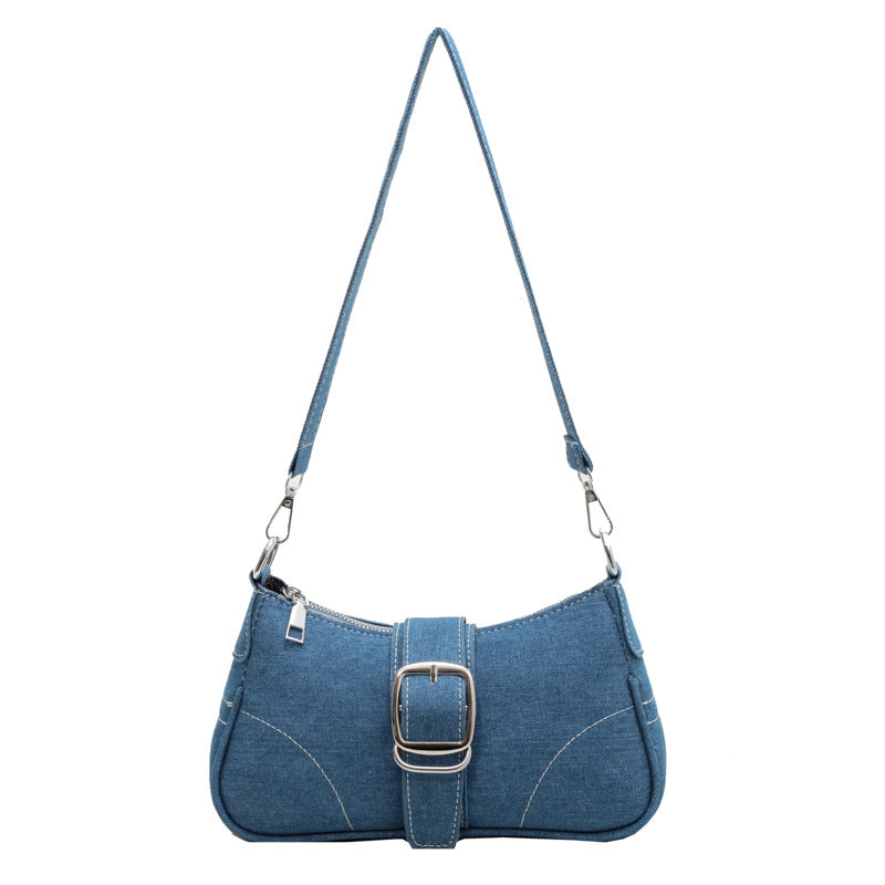 Chic dark blue versatile women's handbag. Can be worn as shoulder or cross-body bag with buckle.