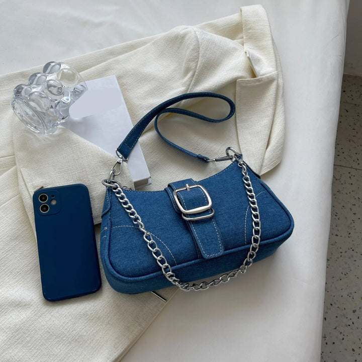 Everyday women's dark blue two-way shoulder bag with elegant buckle. Practical and chic accessory.