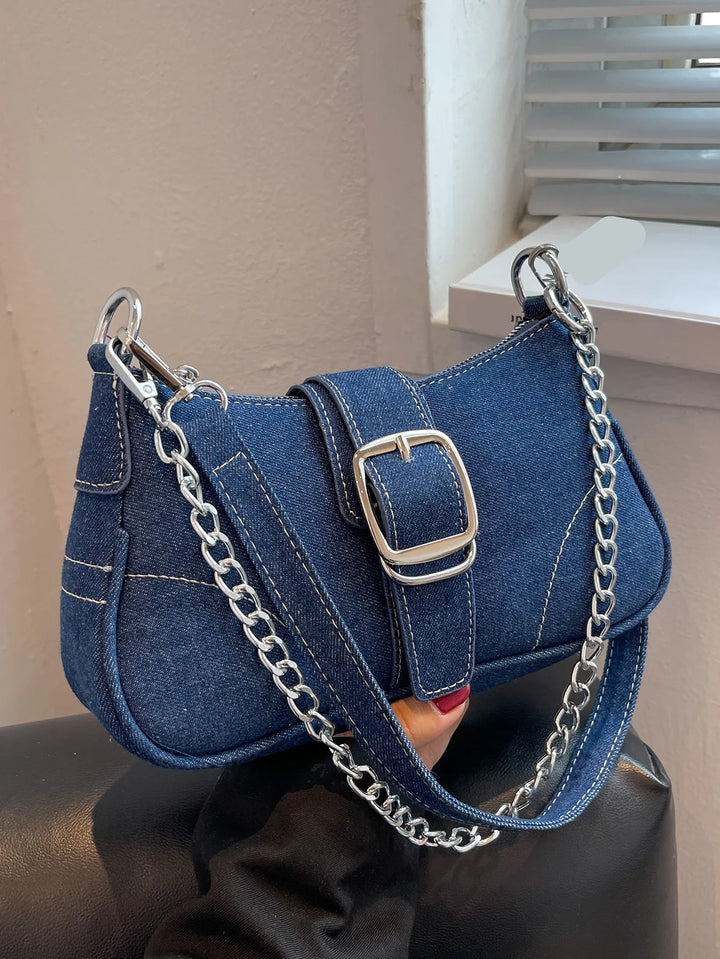 Dark blue women's two-way shoulder handbag with chic buckle closure. Versatile for everyday use.