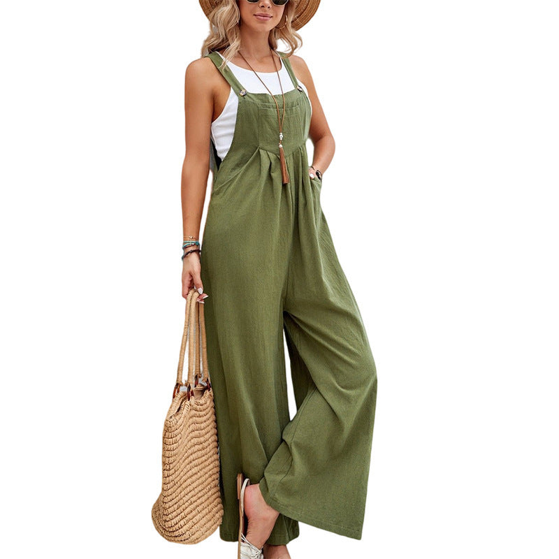 Woman wearing a relaxed fit wide leg dungaree jumpsuit. Casual summer fashion for easy wear.