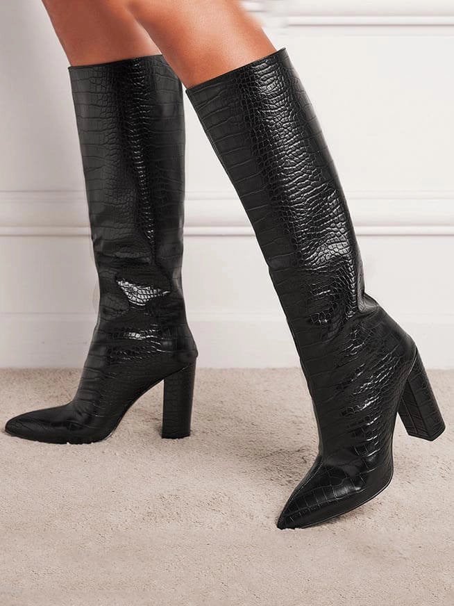Chic women's croc print knee high boots featuring a sleek pointed toe and comfortable block heel. Fashionable.