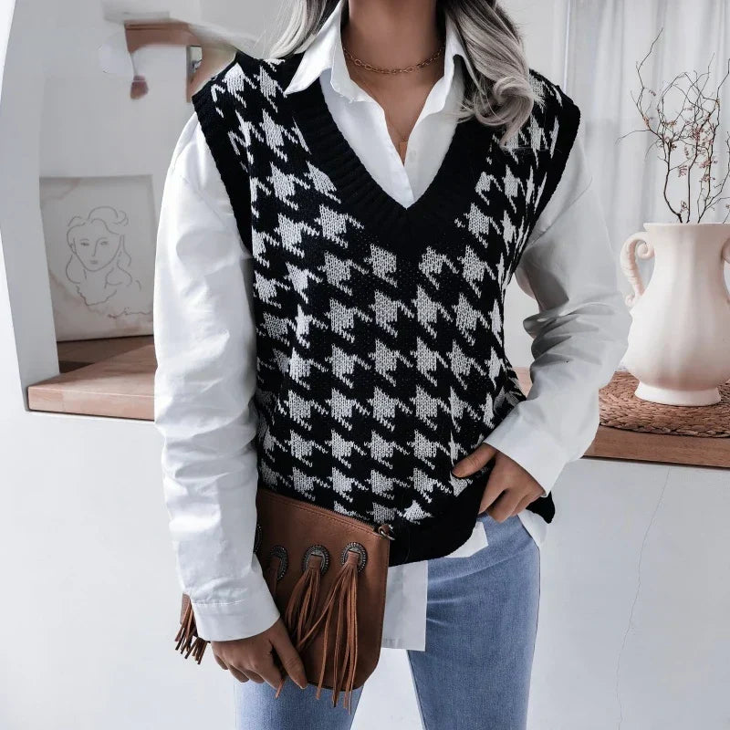 Sophisticated women's black & white houndstooth V-neck knitted pullover vest, ideal for fashion layering.
