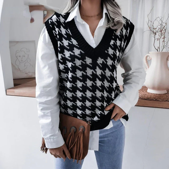 Sophisticated women's black & white houndstooth V-neck knitted pullover vest, ideal for fashion layering.