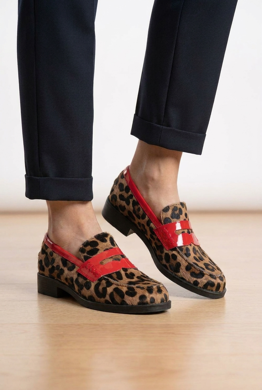 Women's leopard print platform penny loafers. Stylish slip-on shoes with a chunky sole for fashion-forward comfort.