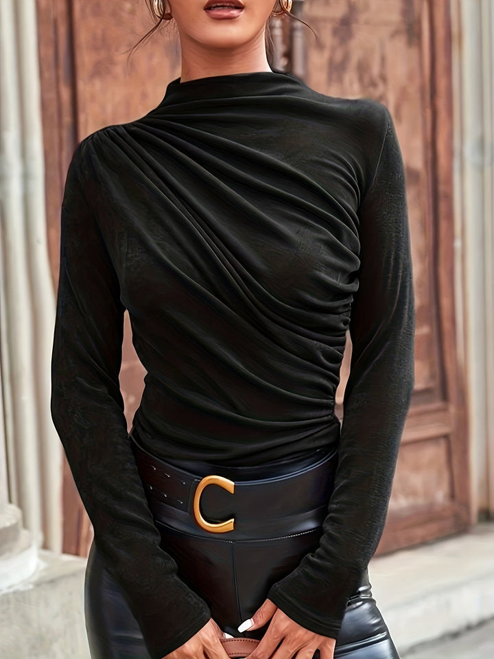Chic women's black mock neck ruched long sleeve blouse. A fitted, elegant top ideal for autumn fashion.