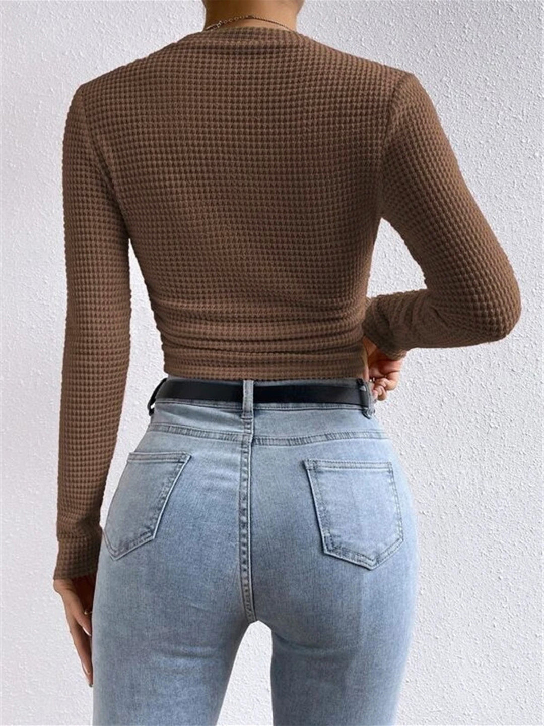 Women's versatile textured long sleeve crew neck top, perfect for layering and style.