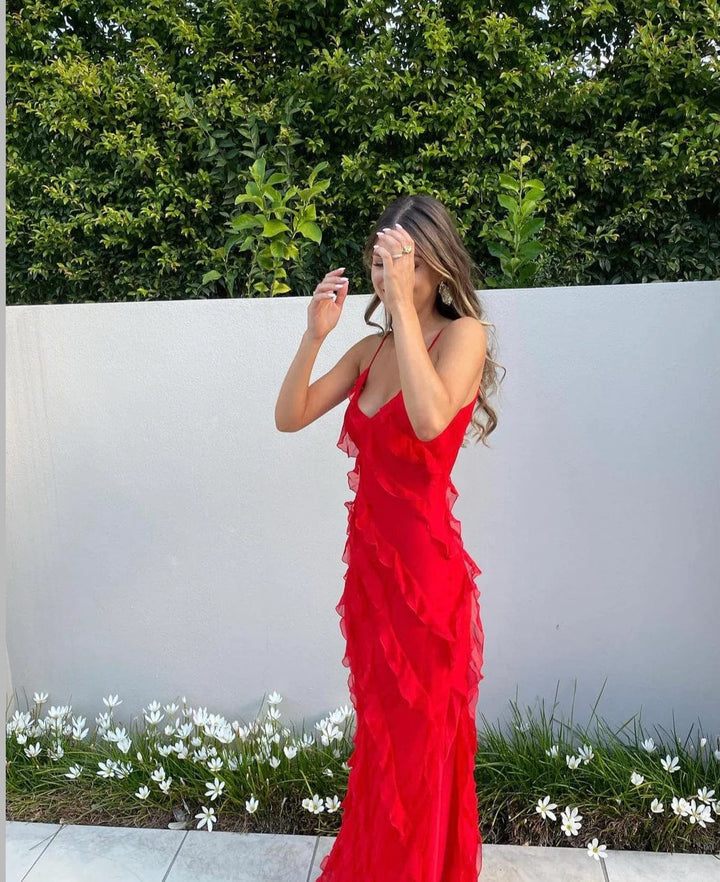 Stylish women's evening dress featuring ruffles & thin straps, a perfect formal gown for special events.