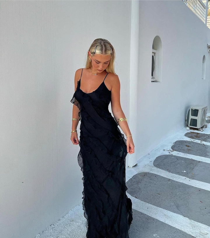 Sophisticated women's evening maxi dress with flattering ruffles and delicate spaghetti straps.