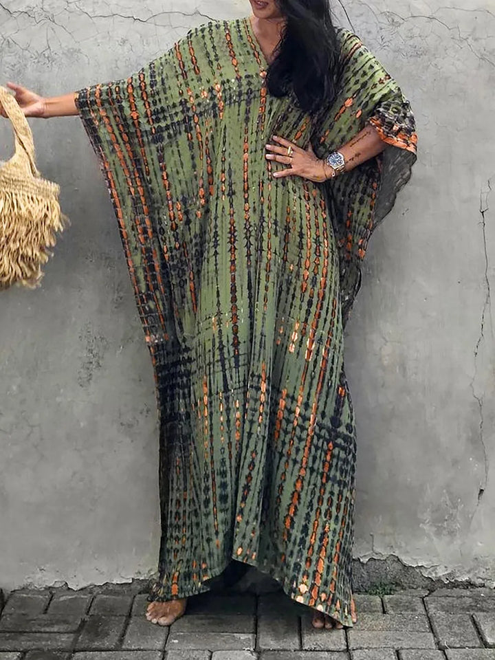 Stylish women's boho tie-dye long dress. Flowy & vibrant, perfect as a summer maxi dress.