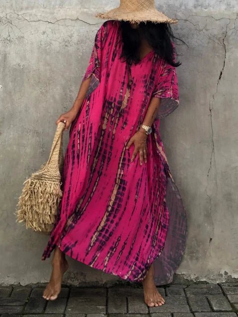 Unique vibrant tie-dye pattern on a women's long boho maxi dress. Flowy & perfect for summer.