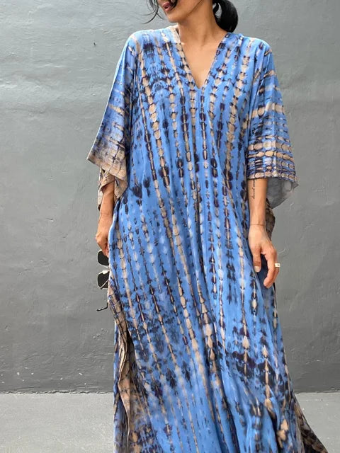 Flowy women's tie-dye maxi dress, comfortable & relaxed for casual wear. Boho festival fashion.