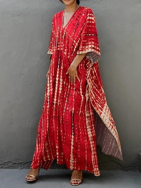 Vibrant boho tie-dye long dress for women. Ideal summer beachwear or festival maxi dress.