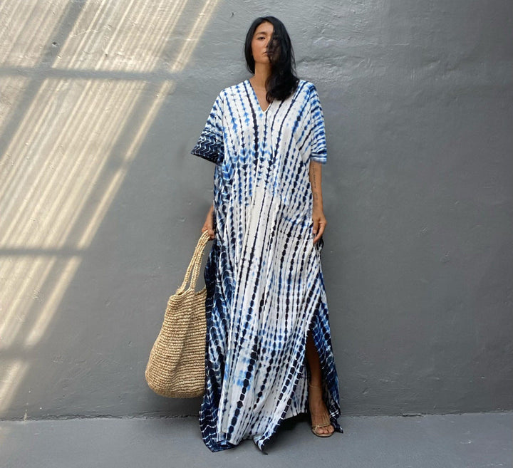 Relaxed women's casual maxi dress in a vibrant boho tie-dye pattern. Perfect for summer days.