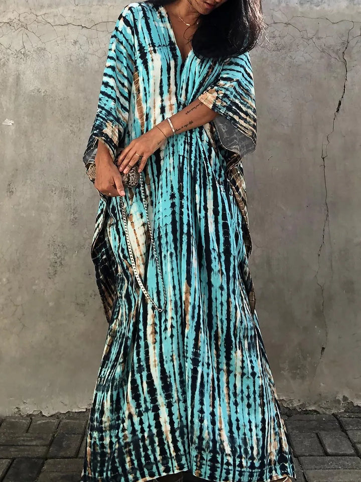 Close-up of the unique vibrant tie-dye pattern on a women's boho long maxi dress.