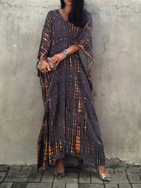 Vibrant tie-dye boho maxi dress for women, a flowy & relaxed casual summer staple.