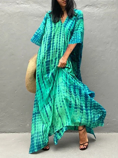 Women's vibrant boho tie-dye maxi dress, relaxed fit. Perfect casual summer dress & beachwear.