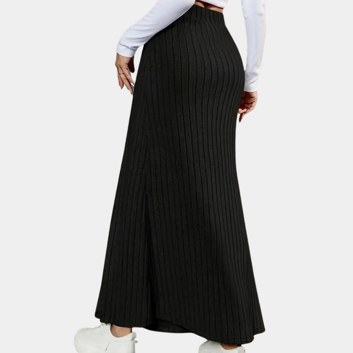 Elegant women's fitted maxi skirt featuring a high side slit & button detail. Chic long skirt for modern style.