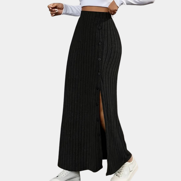 Chic women's long fitted maxi skirt in black, with a stylish side slit. A versatile & elegant women's bottom.