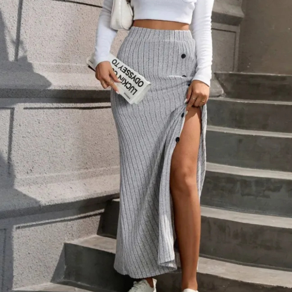 Stylish women's fitted maxi skirt with a high side slit, offering a chic and comfortable long skirt option.