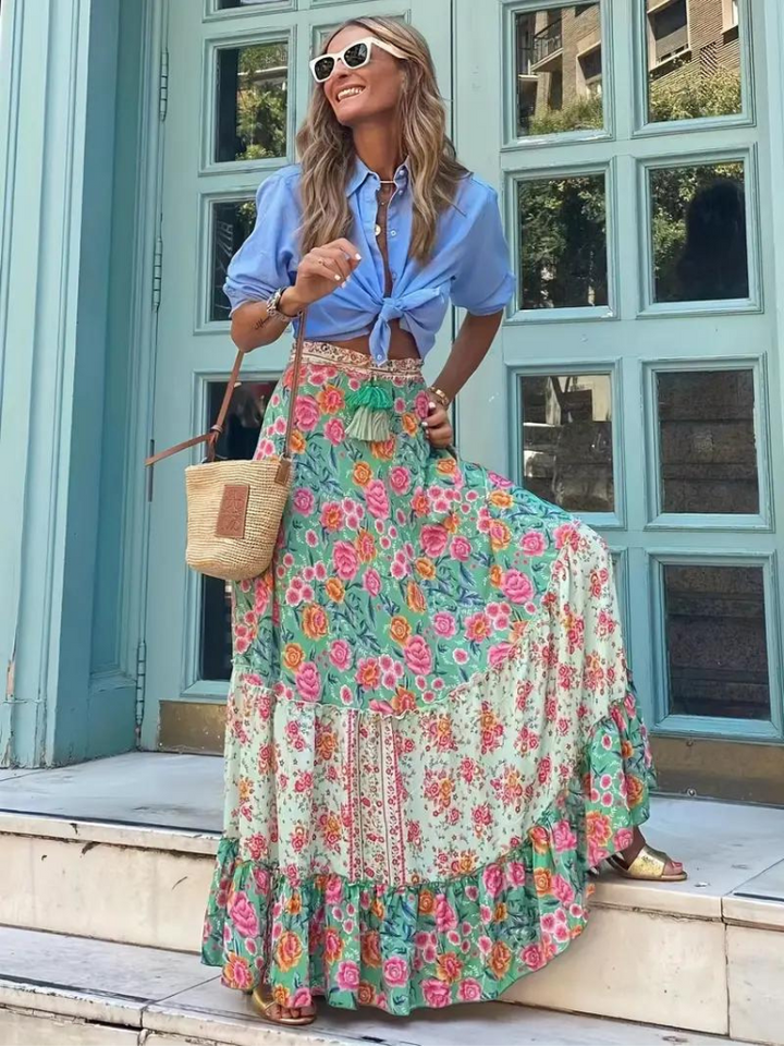 Women's summer tiered maxi skirt with a flowing silhouette, perfect for a chic vacation look.