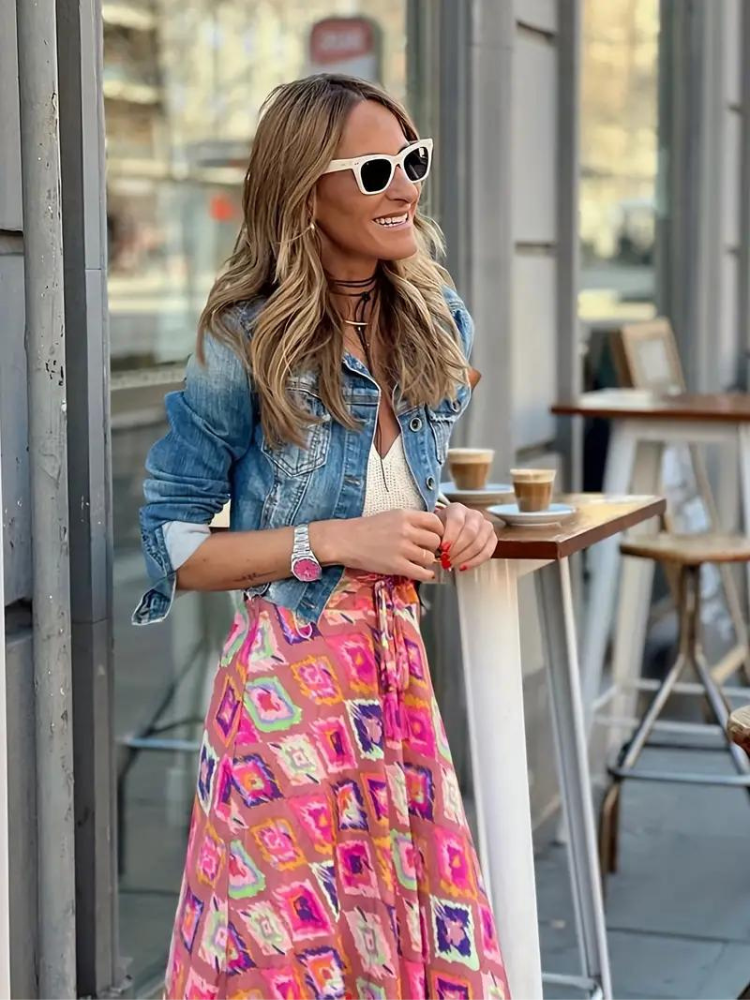 A-line women's tiered maxi skirt, featuring a vibrant print and flowing fabric for summer style.