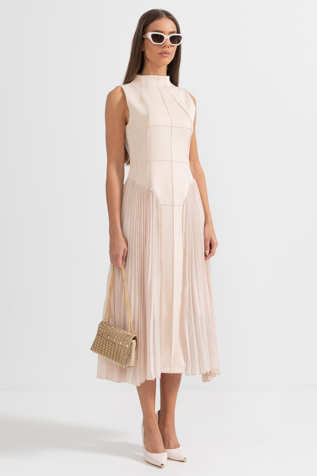 Flattering women's beige pleated midi dress with sleeveless design, an elegant choice for cocktail and evening events.