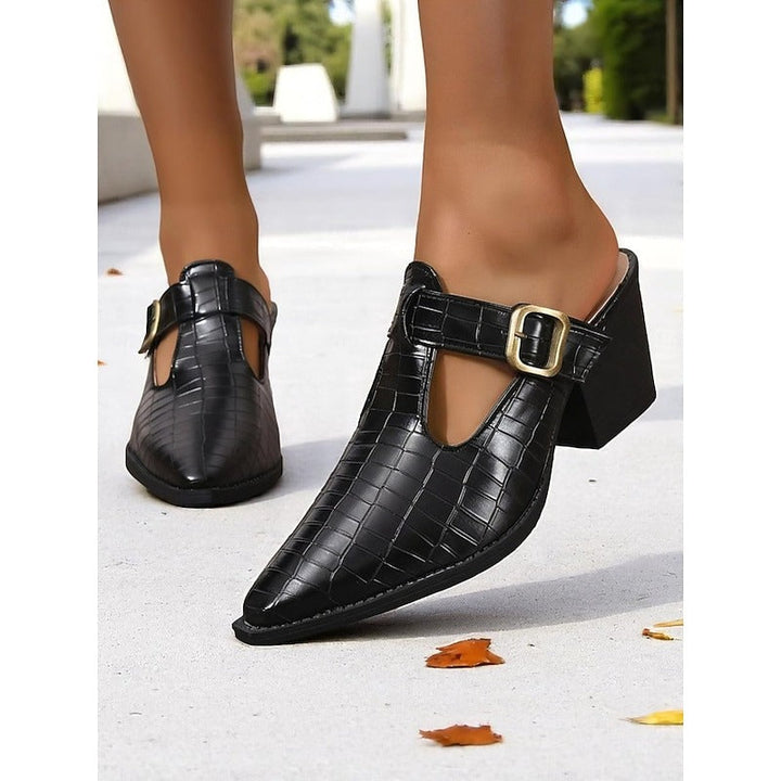 Women's slip-on mules with a trendy cut-out, decorative buckle, and comfortable block heel for daily wear.