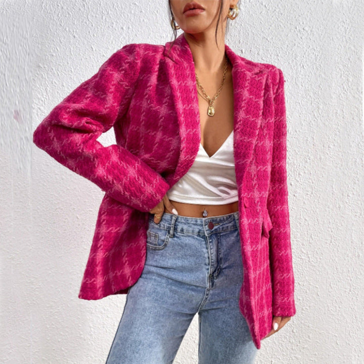 Women's oversized pink blazer with notched lapel, perfect for tailored office fashion or stylish outerwear.