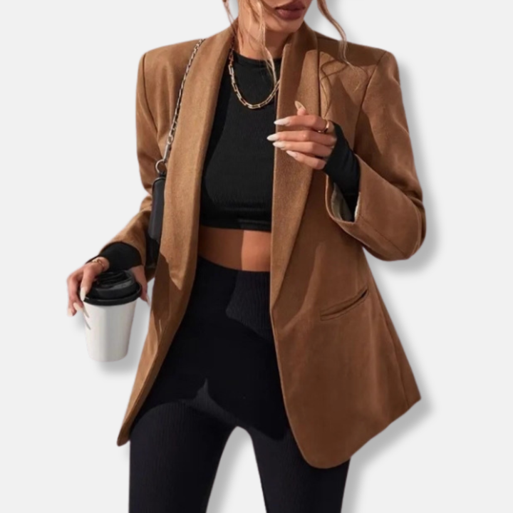 Oversized women's blazer with a sleek shawl collar & open front. Features structured shoulders for a modern tailored look.