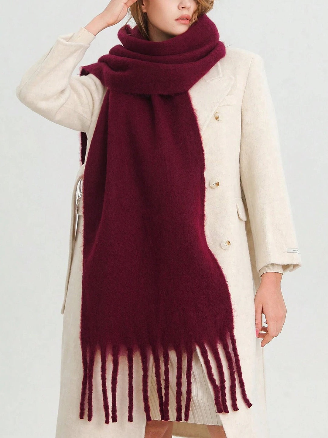 Soft burgundy knit oversized tassel wrap, ideal cozy fashion accessory for cold winter days.