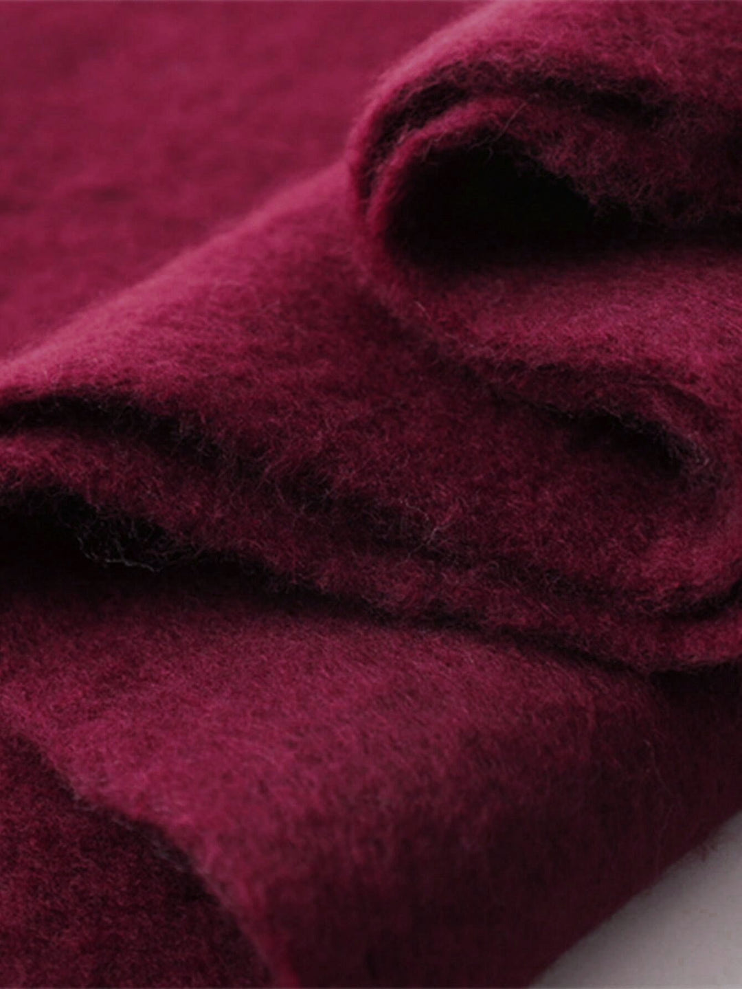 Women's burgundy oversized tassel scarf, a cozy & warm winter wrap accessory for stylish comfort.