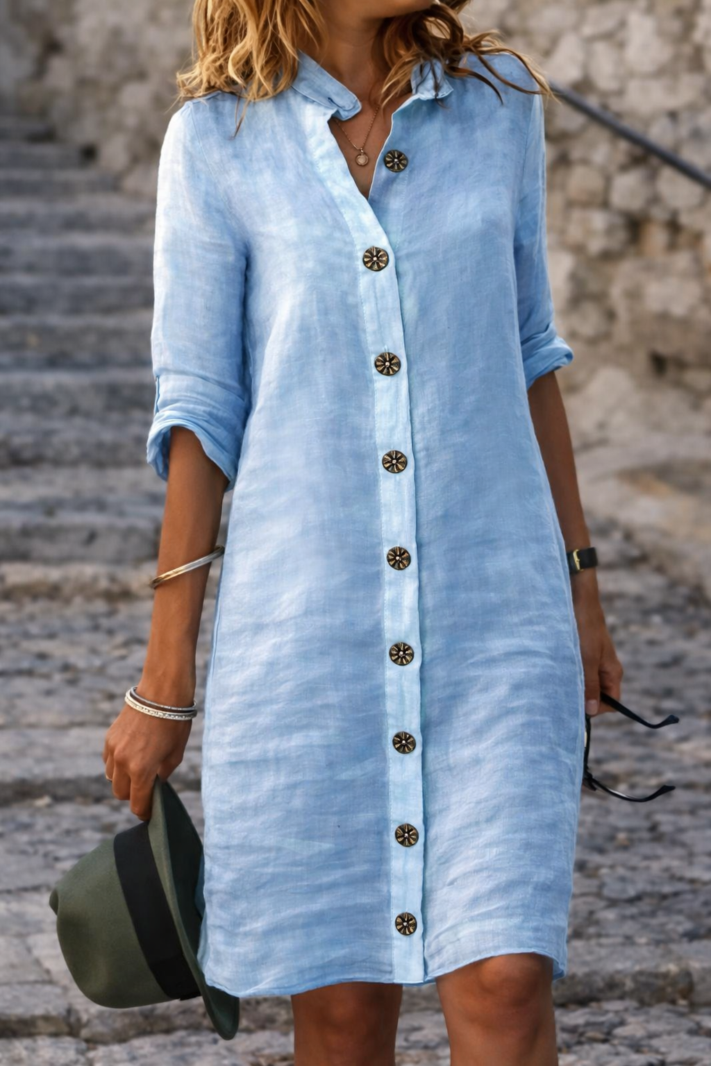 Casual women's mini shirt dress with a button front and half sleeves, ideal for comfortable everyday summer wear.