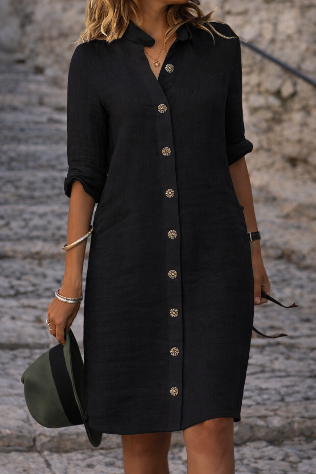 Stylish women's button-front shirt dress featuring half sleeves and a versatile design, great for casual summer days.