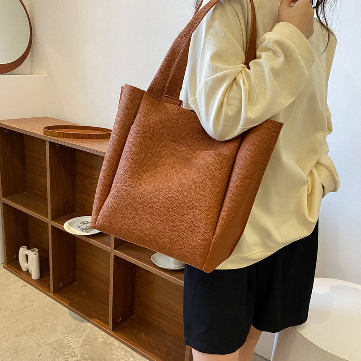 Comfortable straps on a women's large pebbled shoulder tote bag. Structured & versatile, great for work, business & everyday.