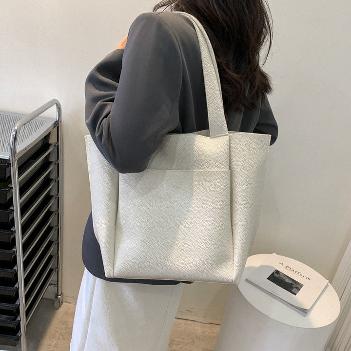 Women's large structured shoulder tote bag, ideal for work, business, and daily errands. Chic and practical "Work to Weekend."