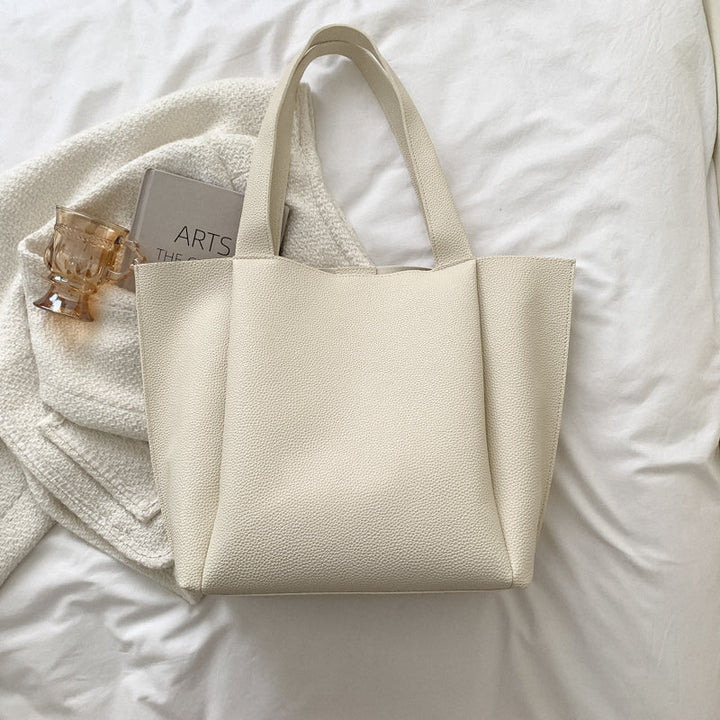 Roomy interior of a women's large structured shoulder tote bag, perfect for work documents, business, and daily essentials.