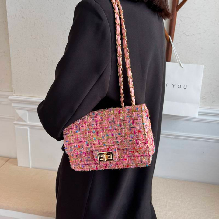 Sophisticated bouclé mini shoulder bag for women, featuring a luxurious gold chain strap & structured design.