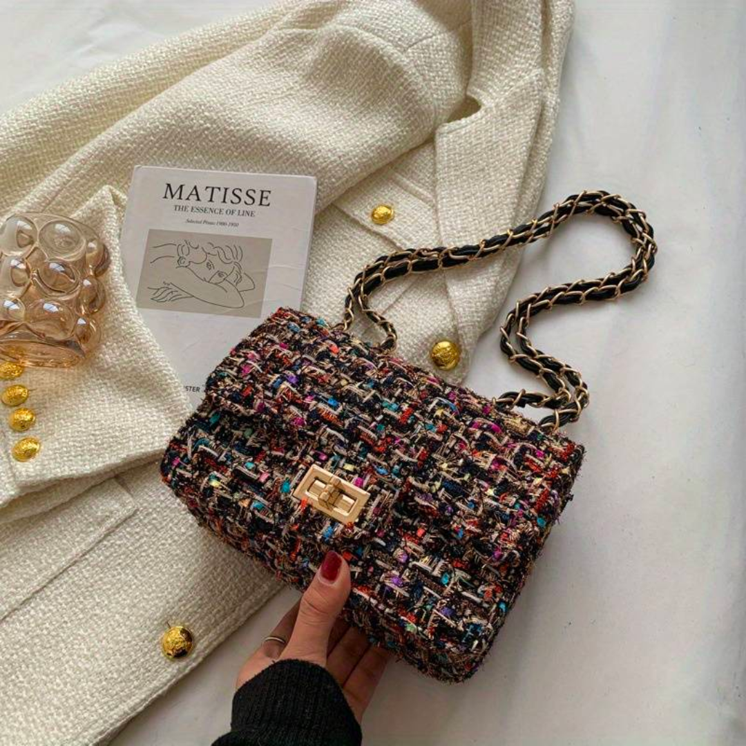 Versatile women's structured shoulder bag, can be worn as a stylish crossbody or an elegant evening purse.