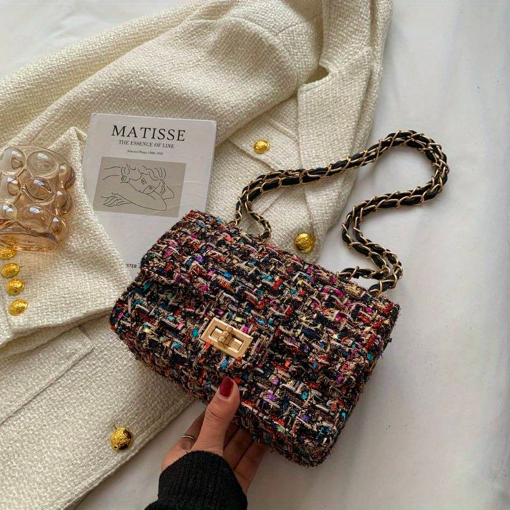 Versatile women's structured shoulder bag, can be worn as a stylish crossbody or an elegant evening purse.