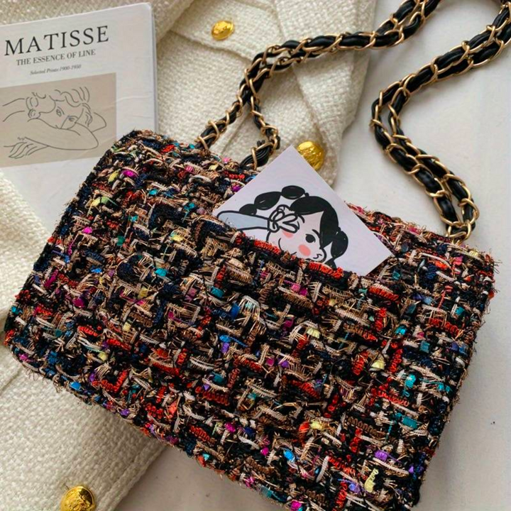 Elegant women's structured shoulder bag. A chic and timeless accessory that transitions seamlessly day to night.